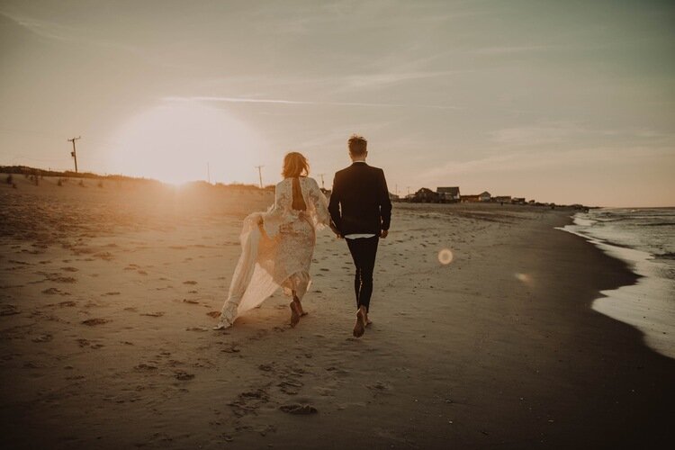 Couple-walking-beach-sunset-ocean-outer-banks-north-Carolina-2.jpg