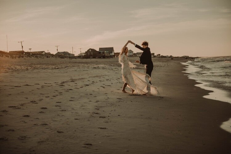 bride-groom-dancing-twiling-fun-portraits-beach-bohemian-elopement-photography-obx-nc.jpg