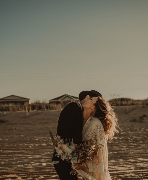bride-groom-hugging-beach-elopement-outerbanks.jpg