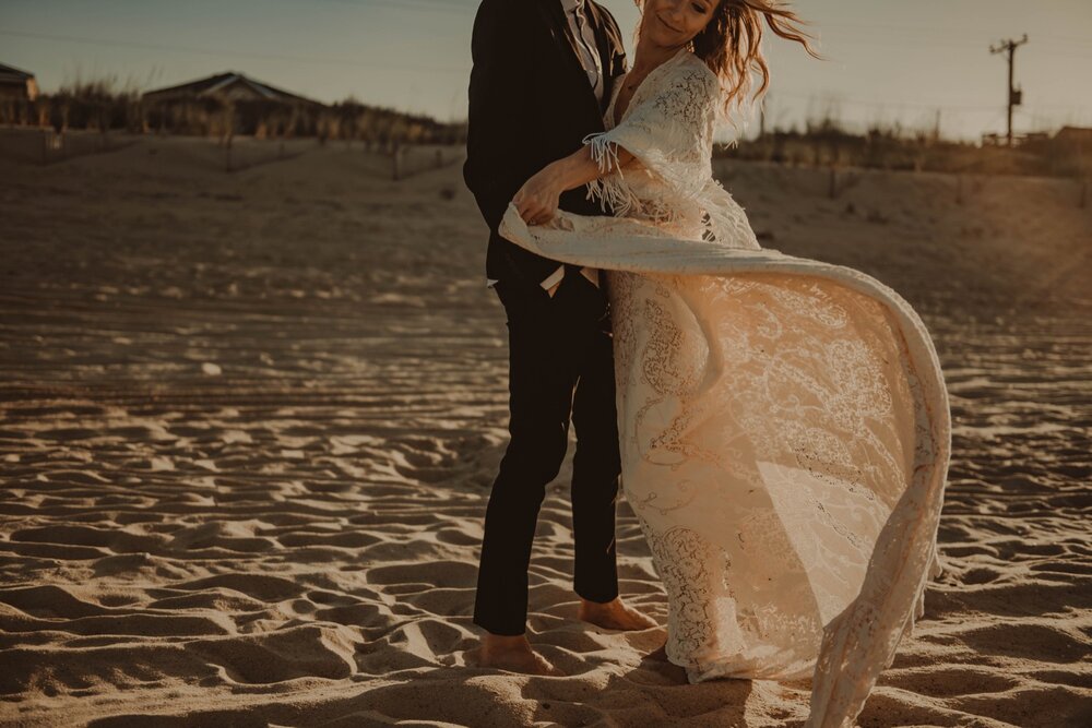 bride-twirling-dress-beach-Couple-portraits-beach-elopement-outer-banks-north-Carolina.jpg