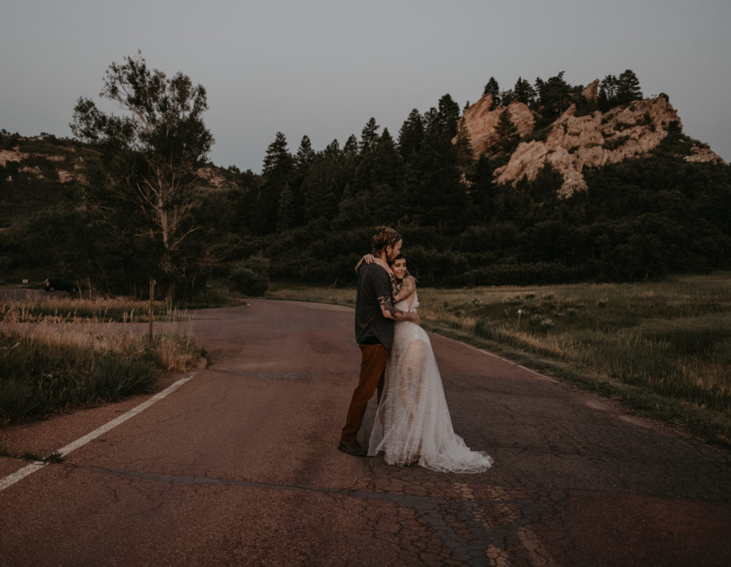 bride and groom hugging after their elopement at Garden of the Gods