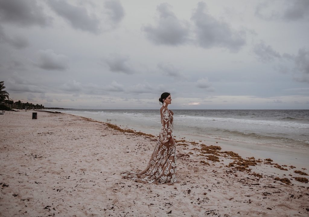 Photo of the bride on the beach taken at an elopement in Tulum Mexico