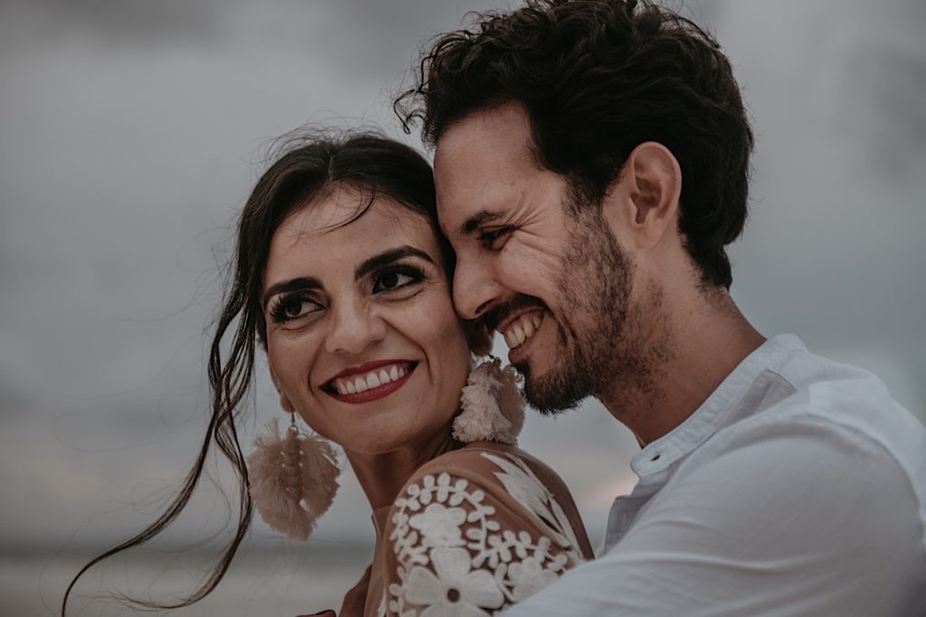 Photo of the bride and groom smiling taken at an elopement in Tulum Mexico