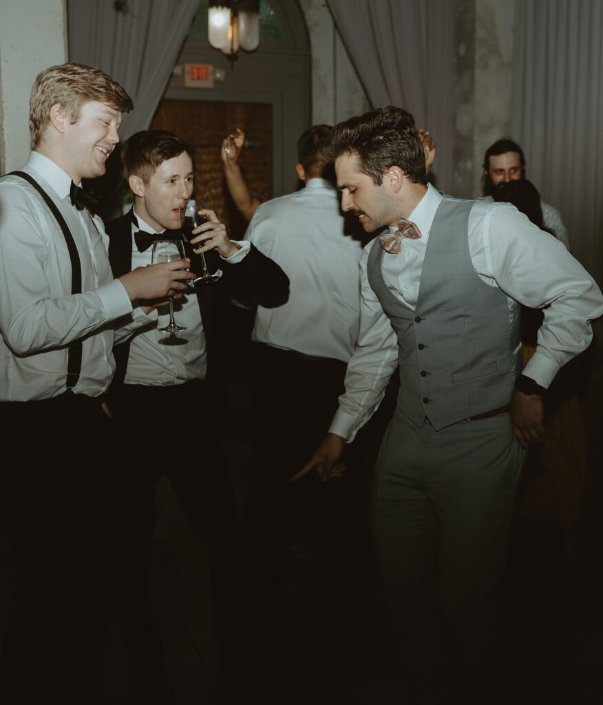 Wedding guests dancing during the reception