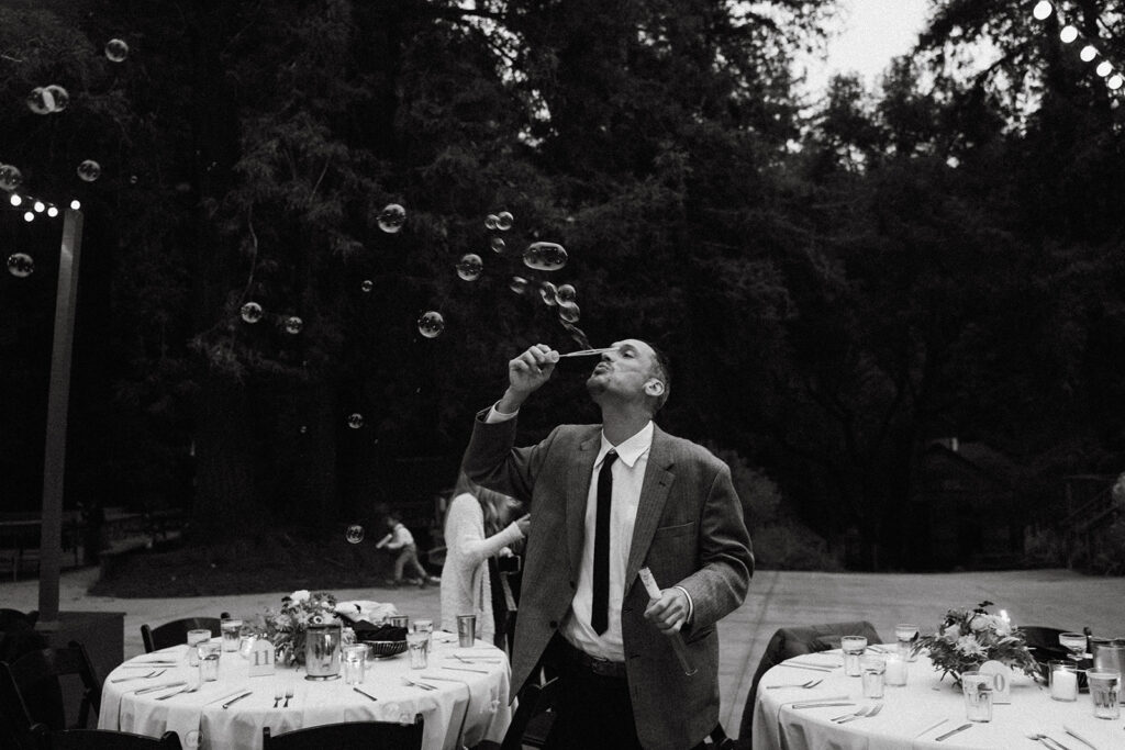 Wedding guest blowing bubbles