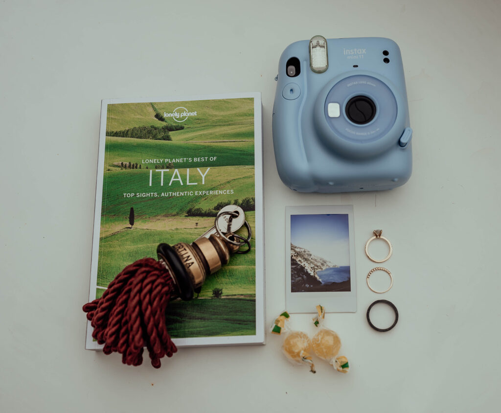 Details from an elopement in Italy with a guide, polaroid camera, and polaroid photo
