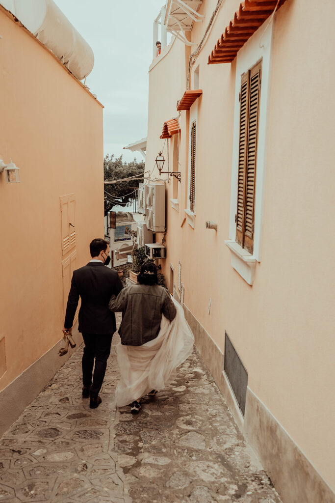 Bride and groom walking in Positano Italy