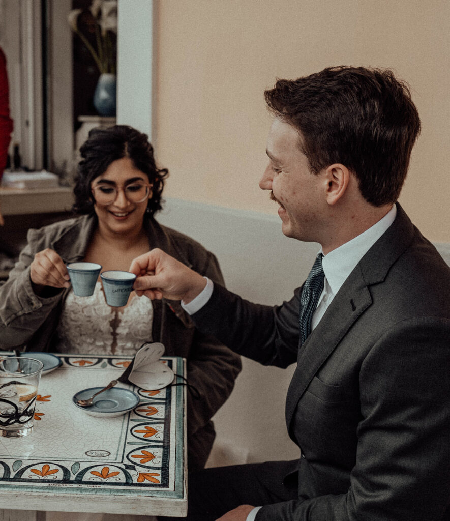 Bride and groom sharing coffee at Café Positano 