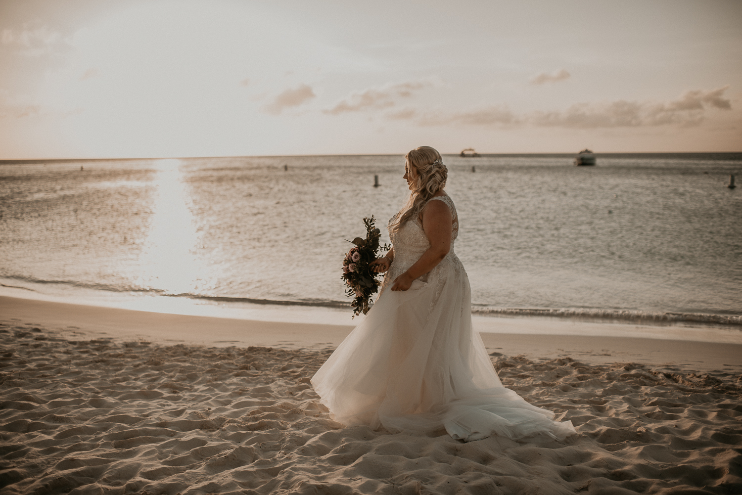 Bride walking on the beach