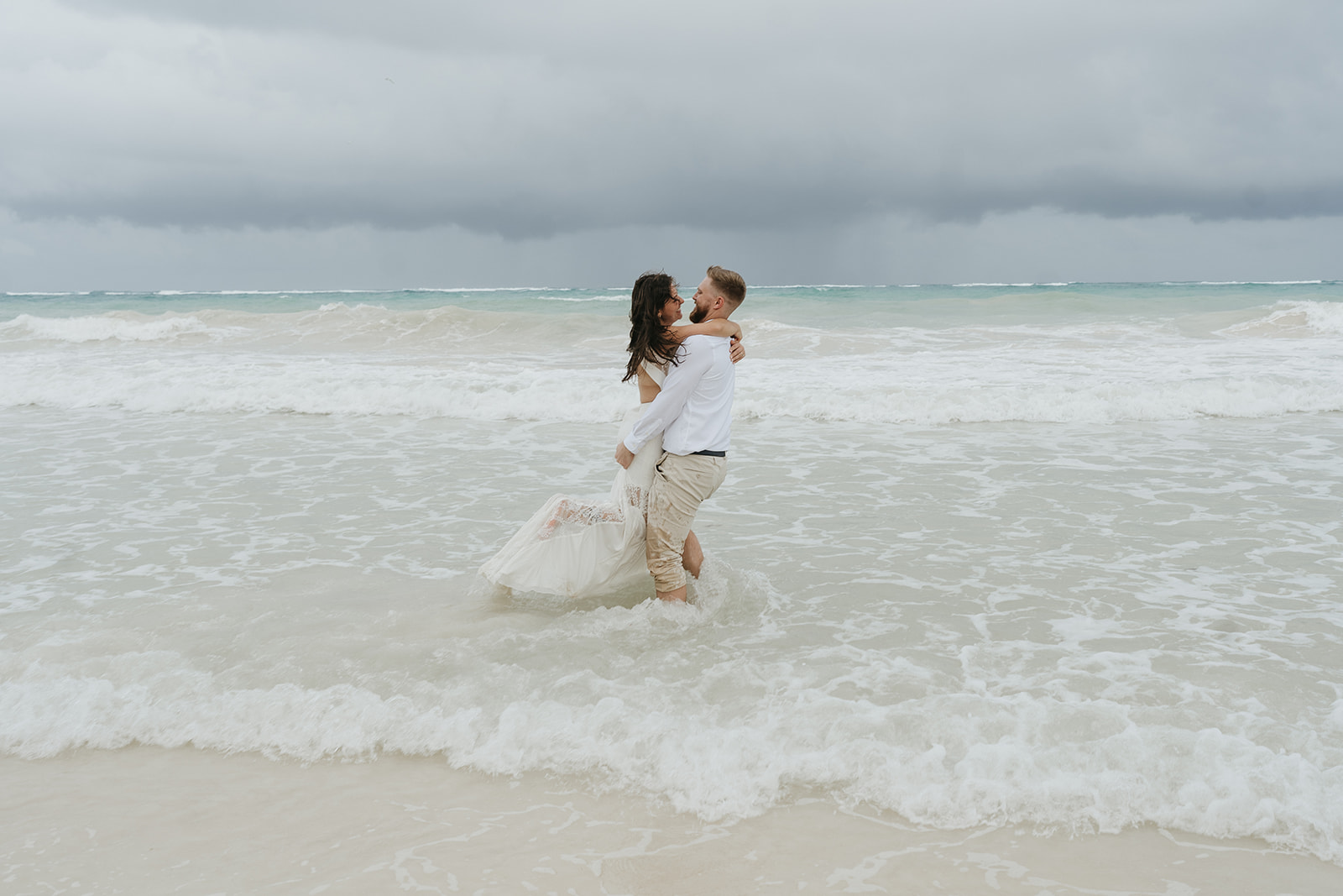 Bride and groom in the ocean