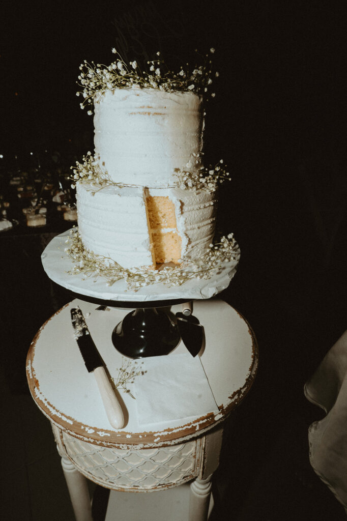 Picture of wedding cake with a slice missing