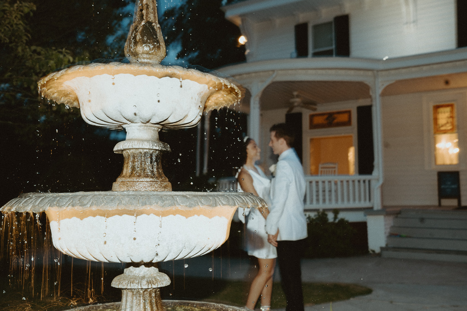 Bride and groom in front of The Wildflower 301 Mansion - Garden wedding venues in Georgia 