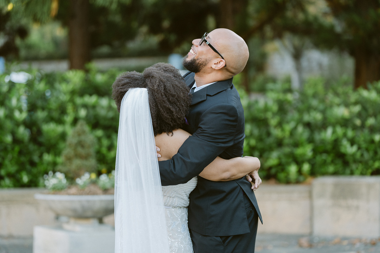 Bride and groom hugging after their first looks. 