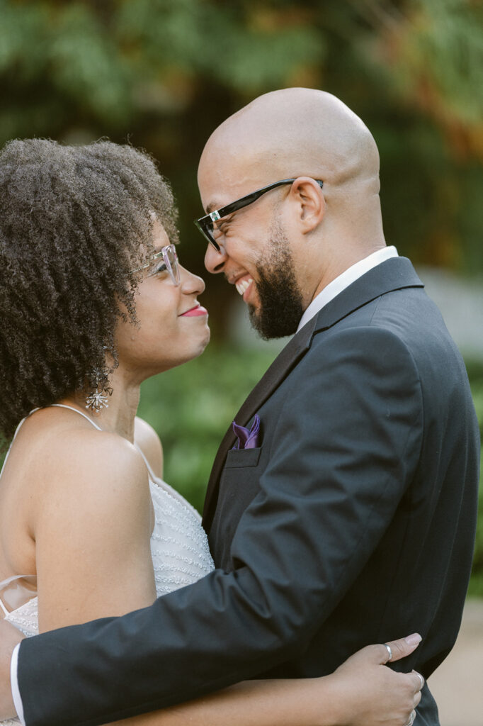 Bride and groom smiling at eachother for their Atlanta Georgia wedding photos. 