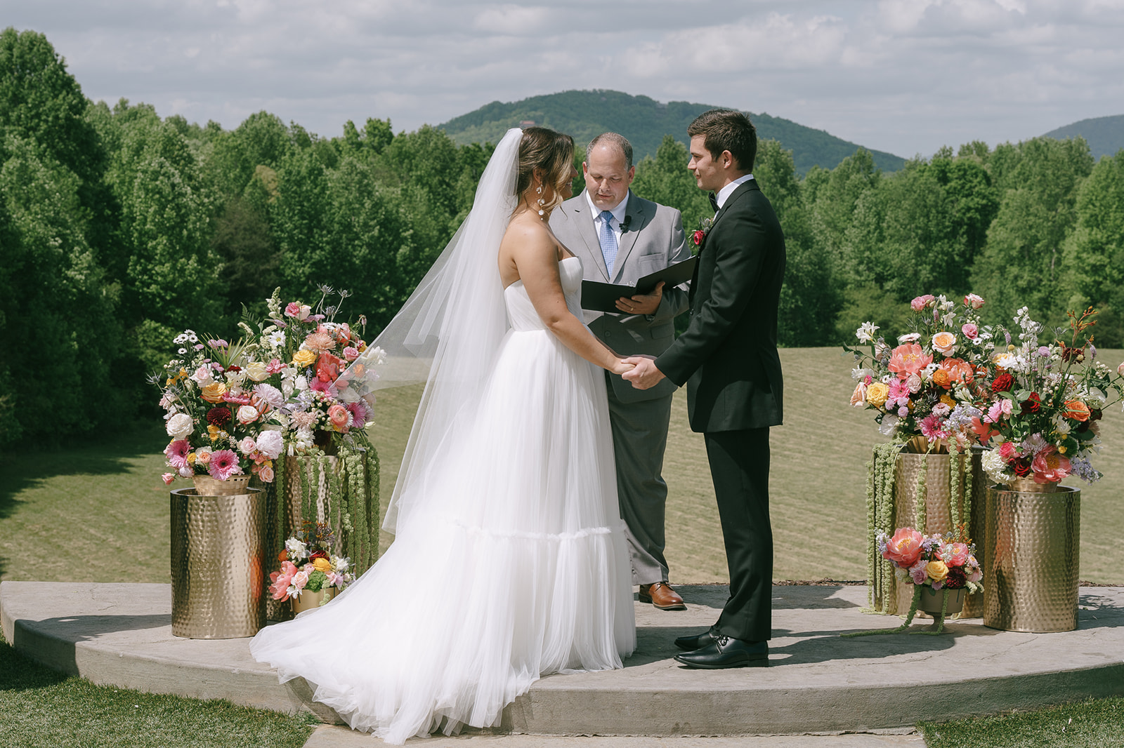 An outdoor spring Meadows at Mossy Creek wedding ceremony in Cleveland, Georgia