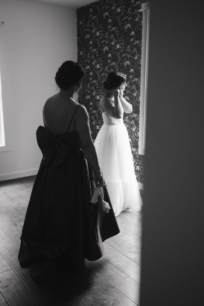 Black and white photo of a bride getting ready