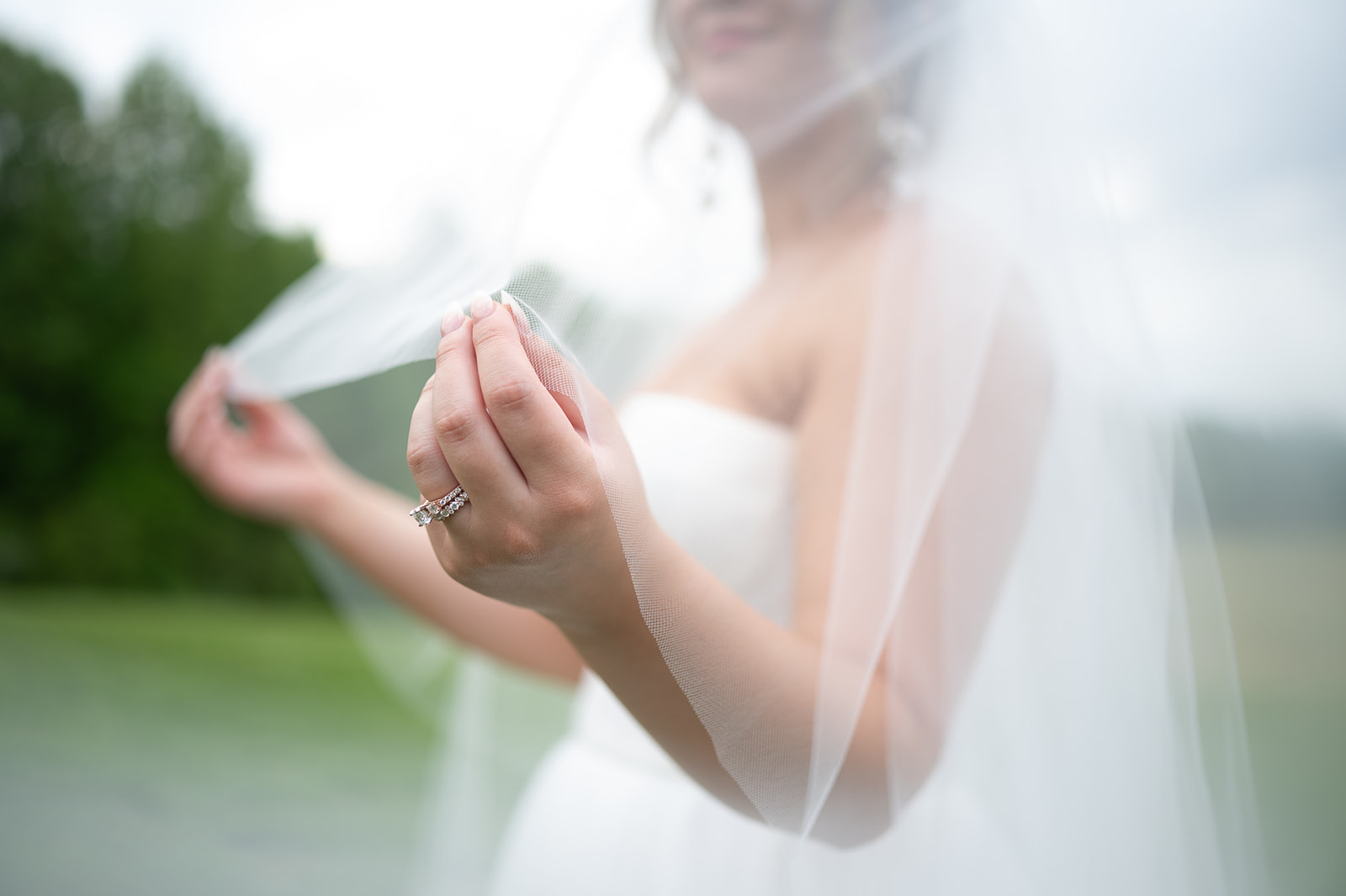 Close up shot of a bride holding her veil 