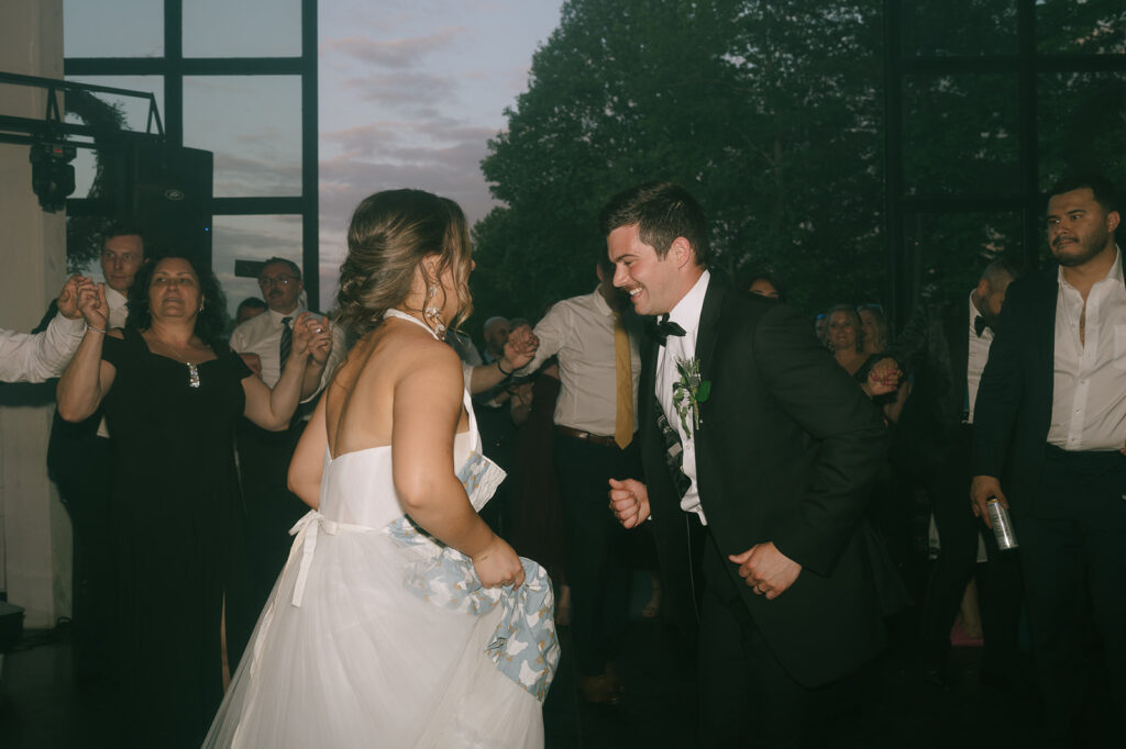 Bride and groom dancing together during their wedding reception
