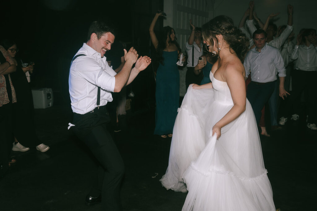 Bride and groom dancing together during their wedding reception