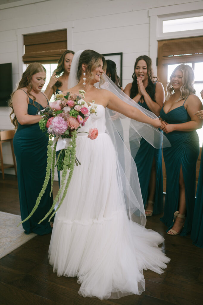 Brides emotional first looks with her bridesmaids