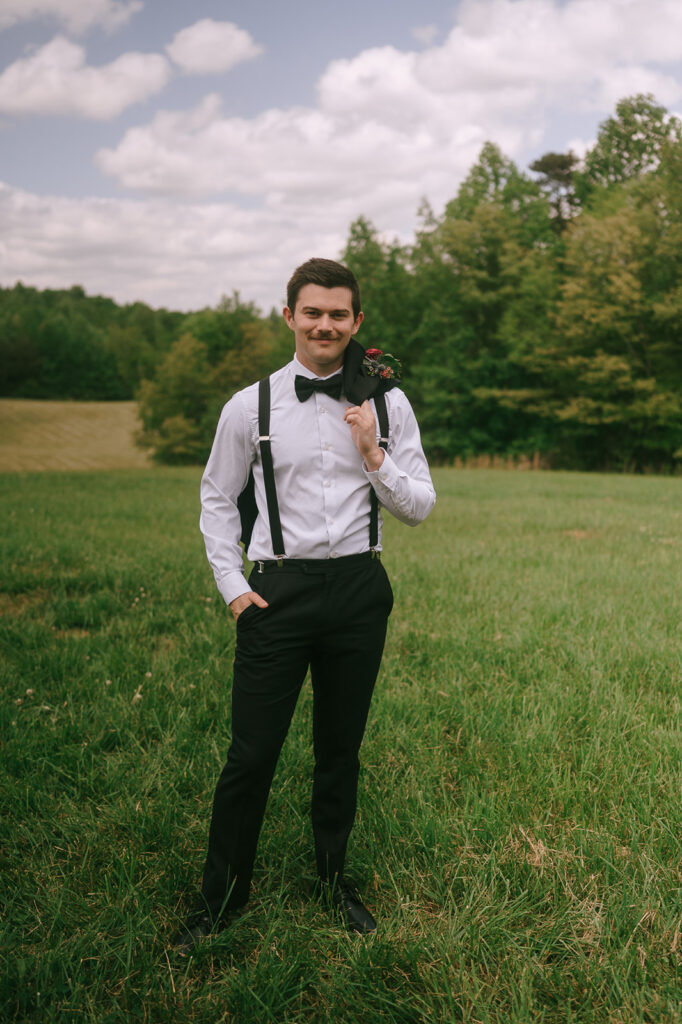 Outdoor grooms portraits from a Meadows at Mossy Creek wedding