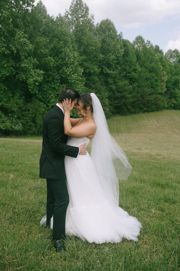 Outdoor bride and groom portraits from a spring Meadows at Mossy Creek wedding in Cleveland, Georgia.
