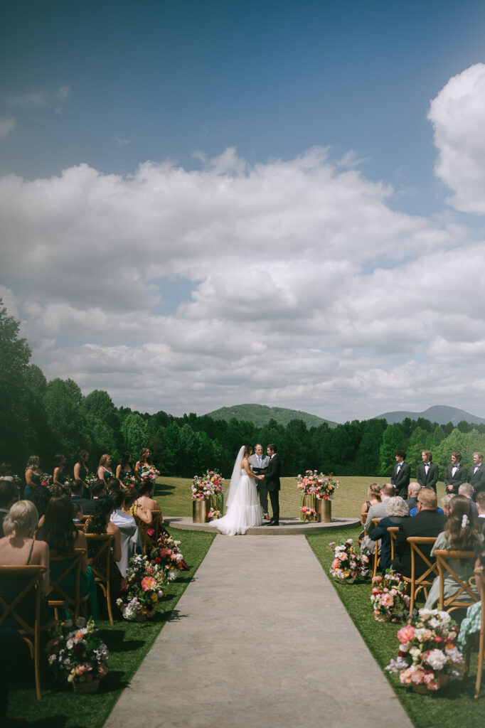 An outdoor spring Meadows at Mossy Creek wedding ceremony