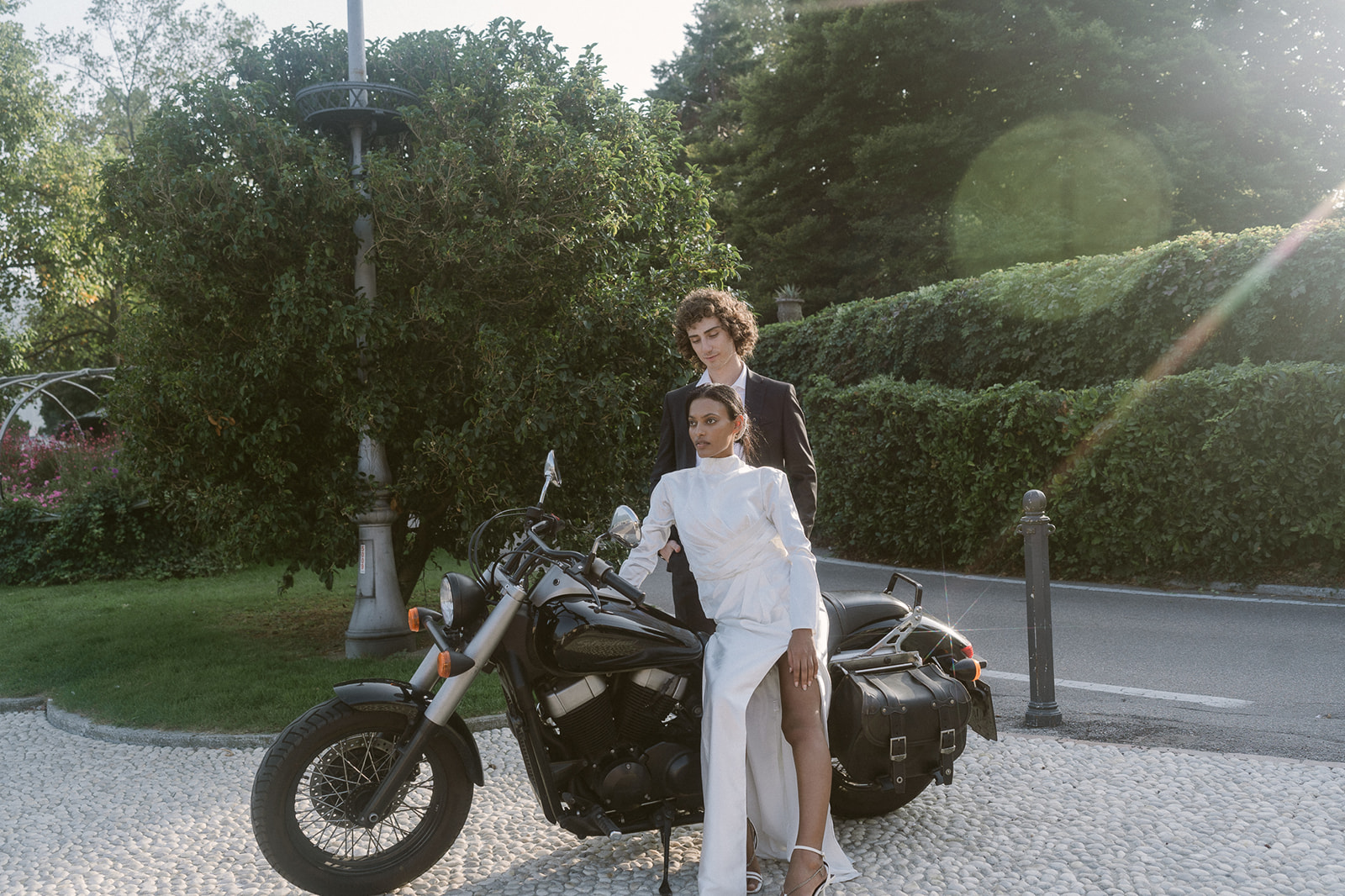 Bride and groom portraits with a bike during their wedding in Lake Como, Italy