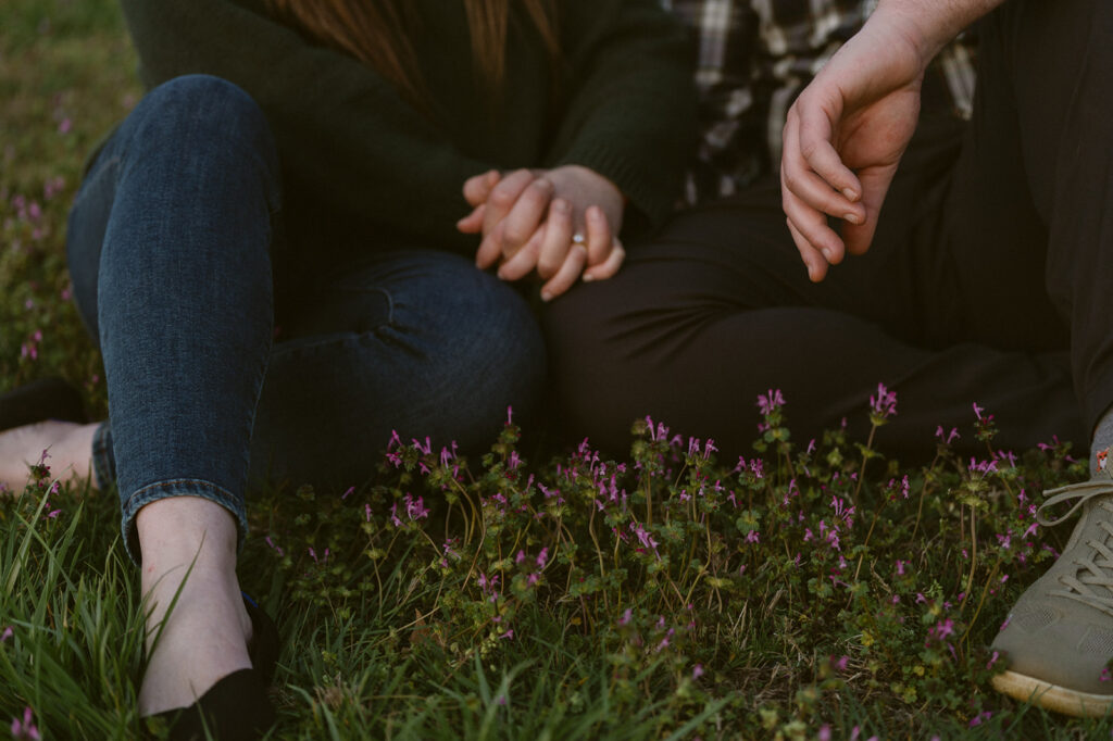 closeup shot of the couple holding hands