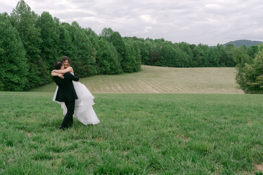 groom hugging the bride