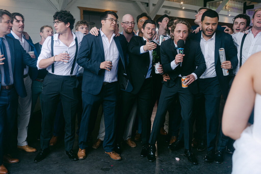 friends of the groom dancing at the wedding party