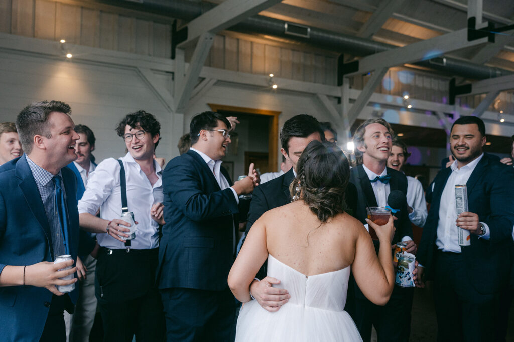 bride and groom kissing at their ethereal wedding reception party