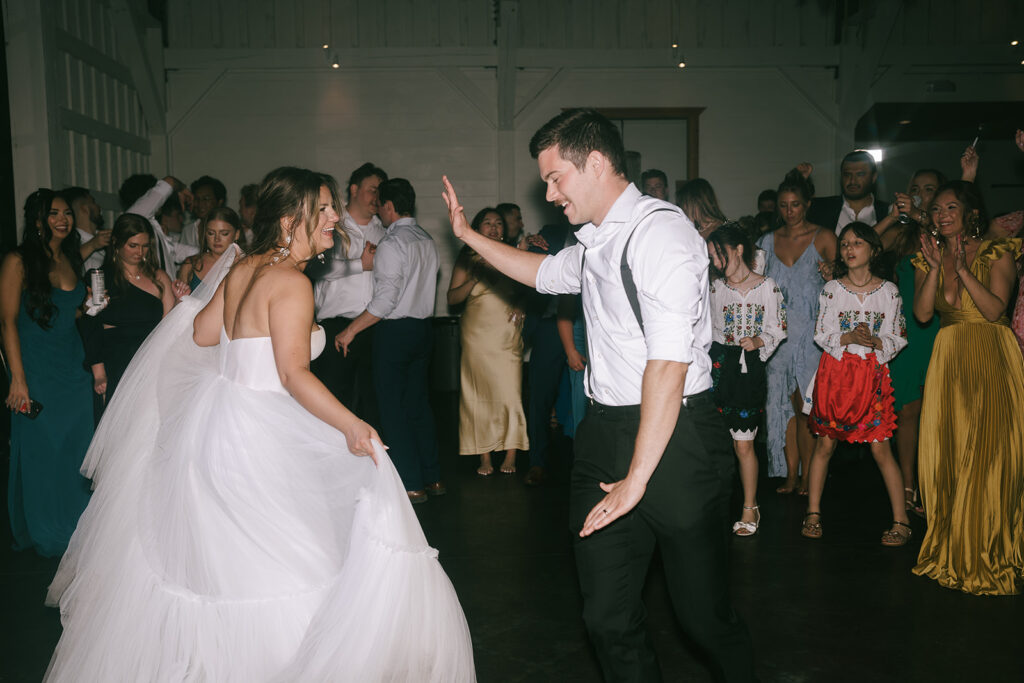 happy newly married couple dancing at their wedding party