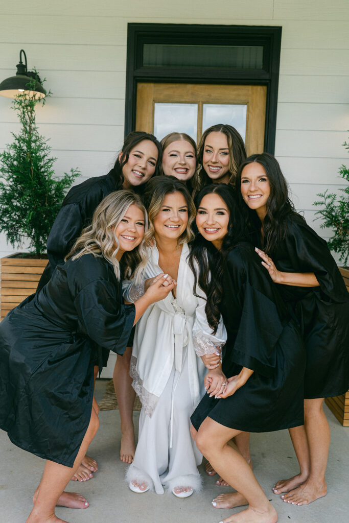 picture of the bride and her bridesmaids before getting ready for the