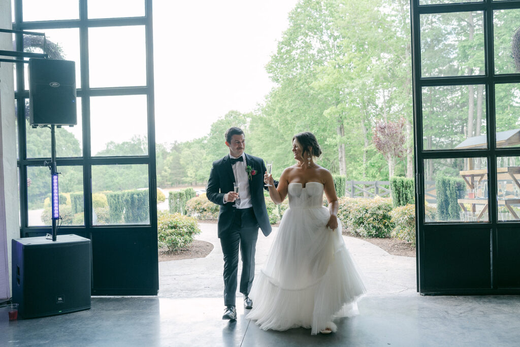 bride and groom entering their wedding reception