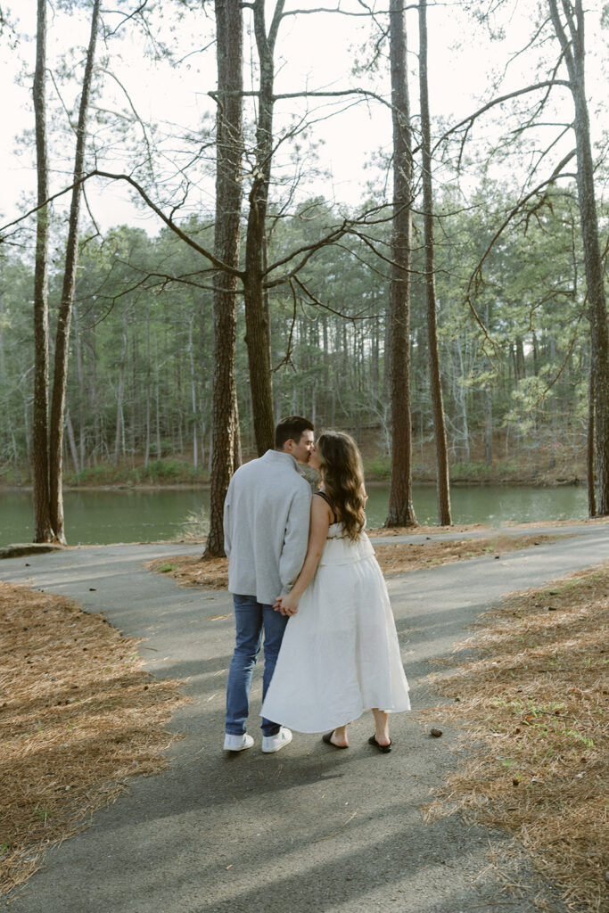 newly engaged couple kissing