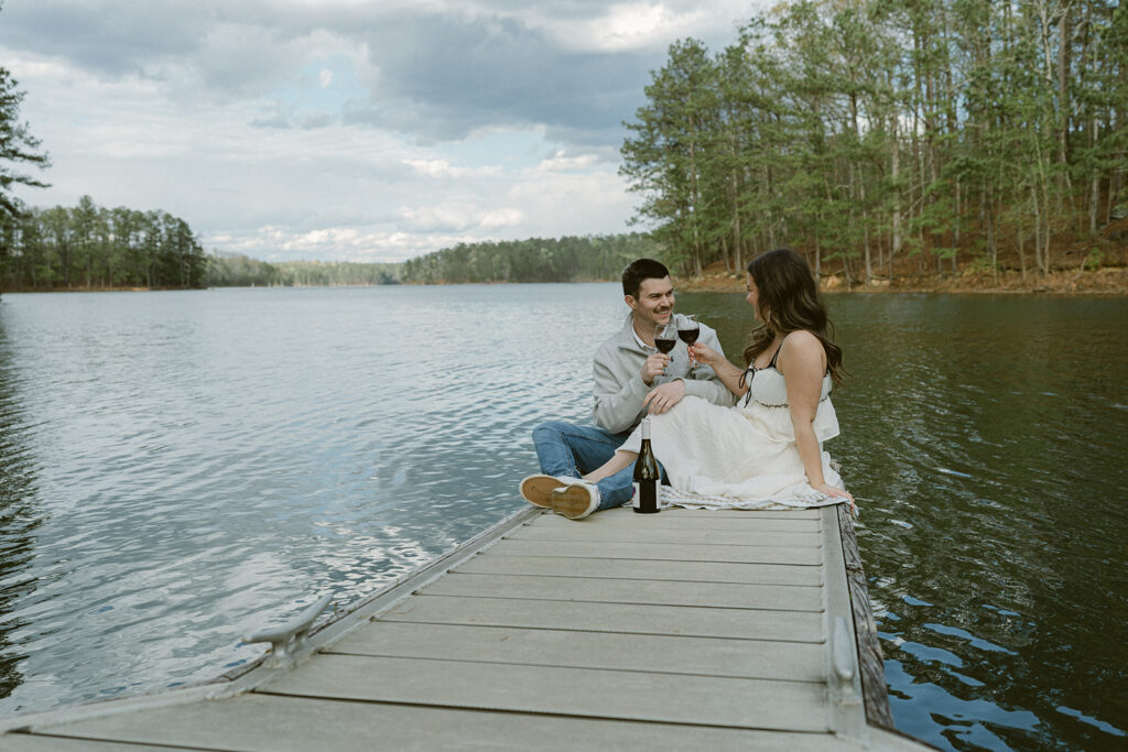 couple drinking wine during their engagement session