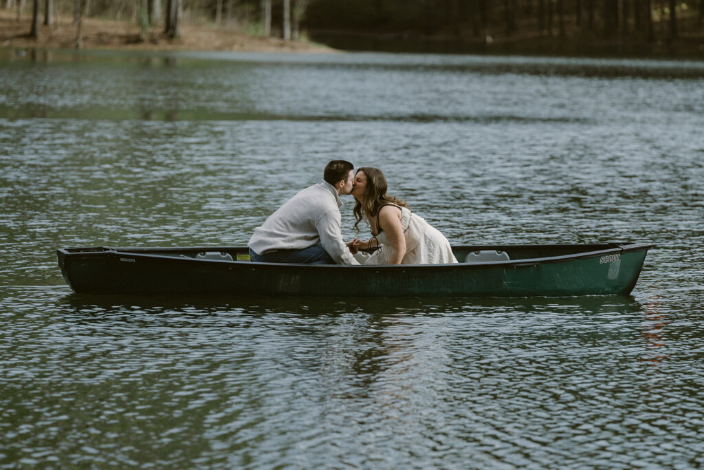 newly engaged couple kissing 