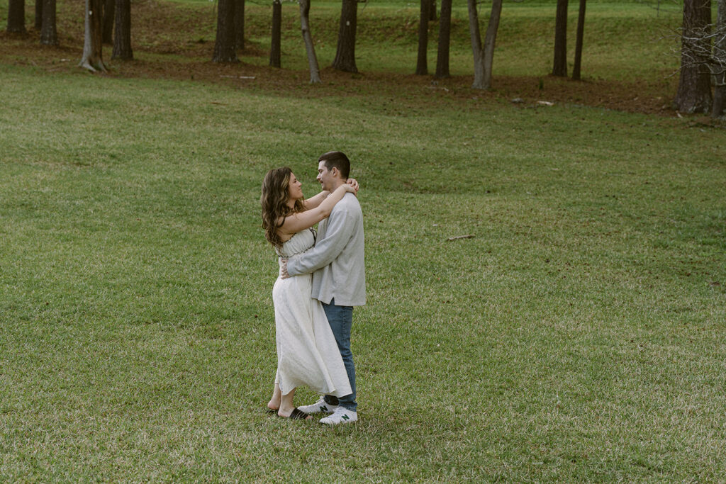 happy couple looking at each other during their unique engagement photos