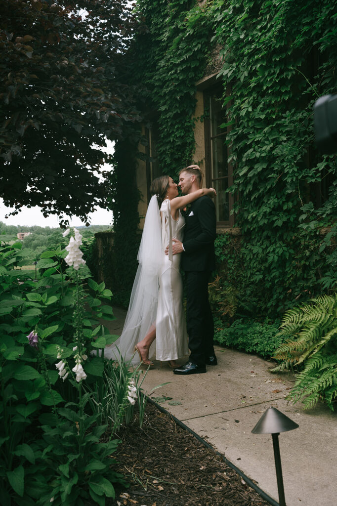 bride and groom looking at each other 