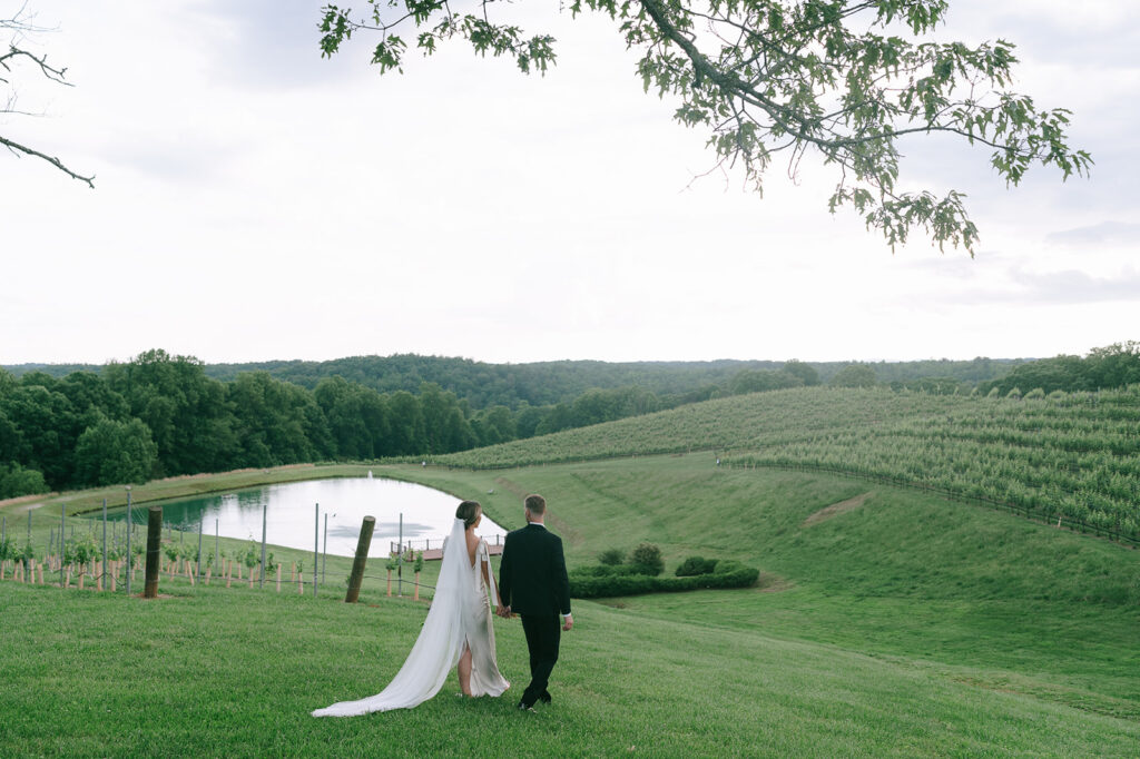 bride and groom walking around their dreamy wedding venue