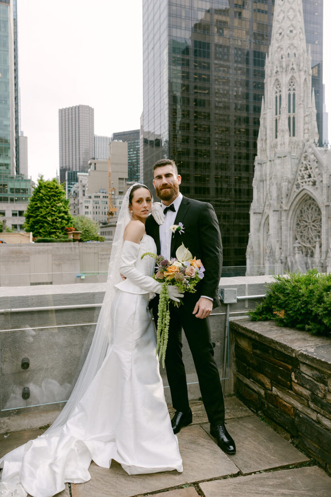 bride and groom looking at the camera during their wedding photoshoot