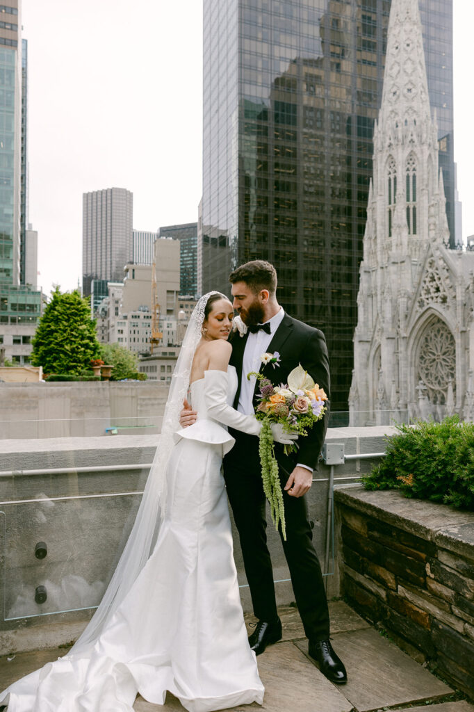 groom kissing the bride on the forehead at 620 loft & garden