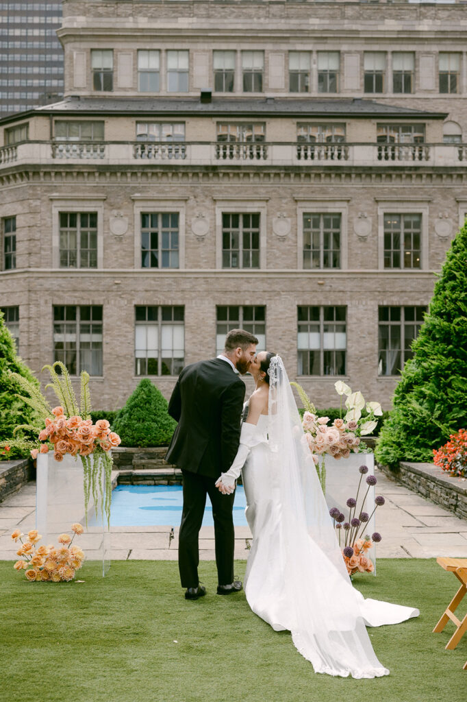 bride and groom holding hands at their wedding venue 