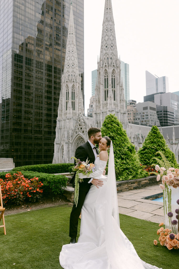 groom kissing the bride on the cheek