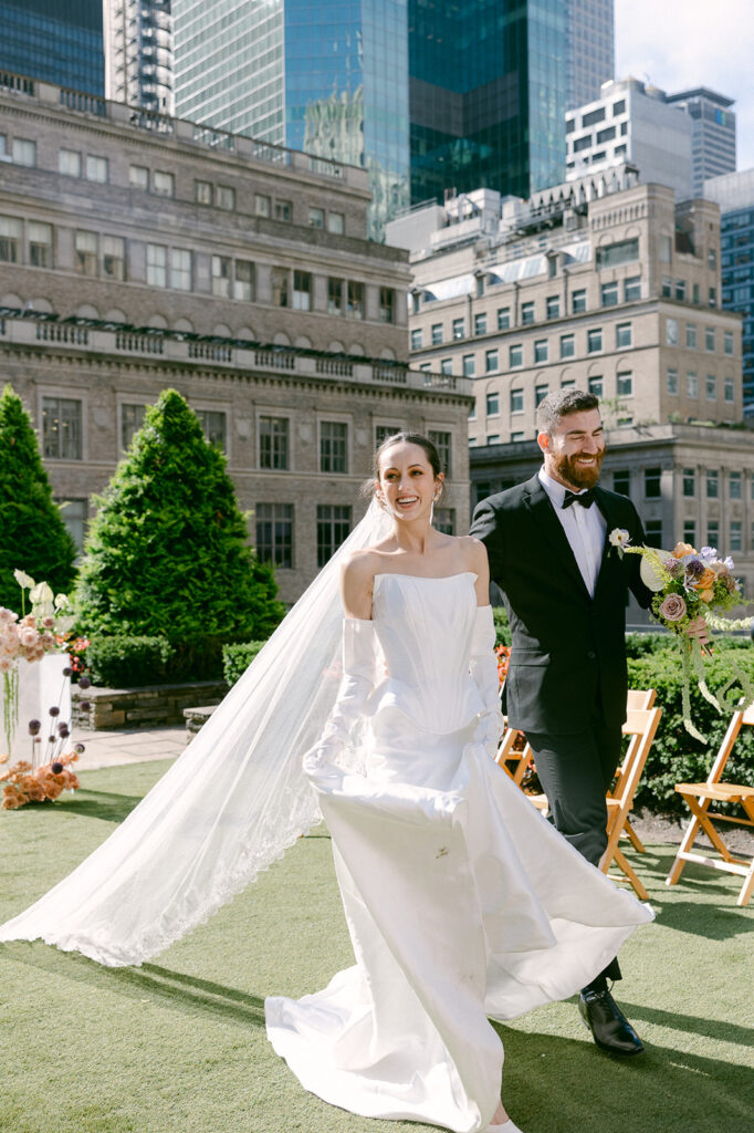 happy bride and groom at their colorful wedding venue