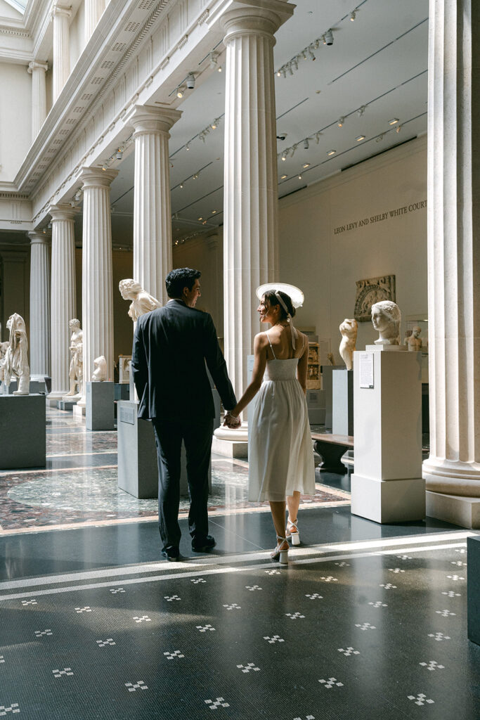 couple holding hands looking at each other 