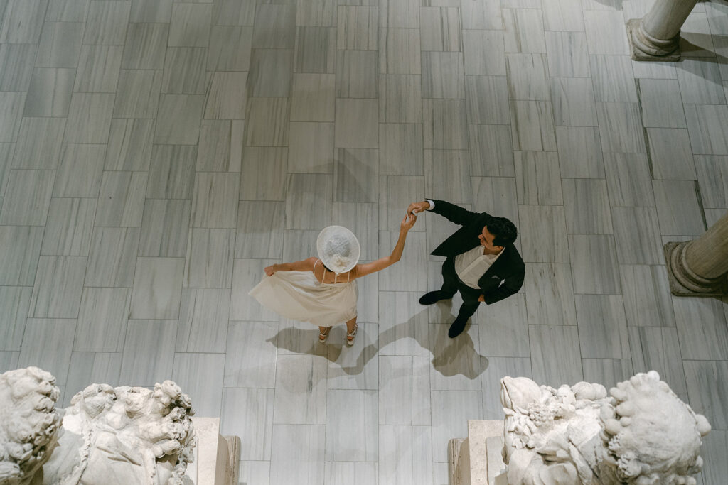 newly engaged couple dancing at the met