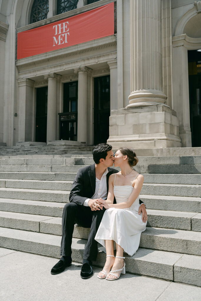 newly engaged couple kissing