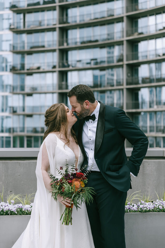 bride and groom kissing at their intentional wedding day 